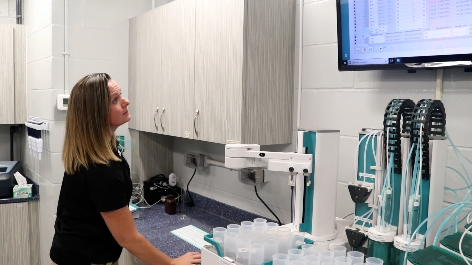 Woman in water quality lab reviewing data