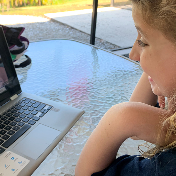 girl looking at computer screen