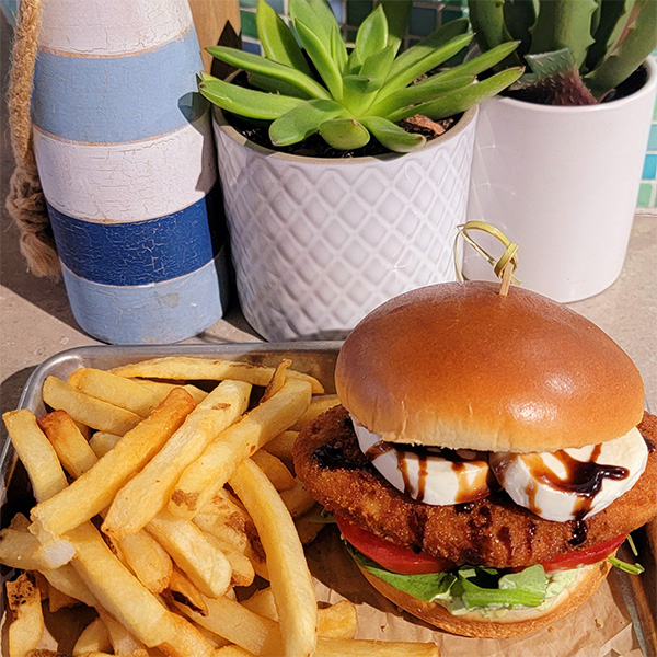 plant based crispy chicken sandwich with french fries