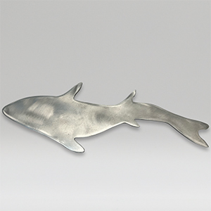 Metal sculpture of a large size fish on a gray background