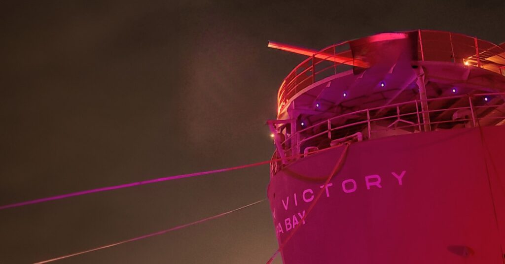 american victory ship in red lights
