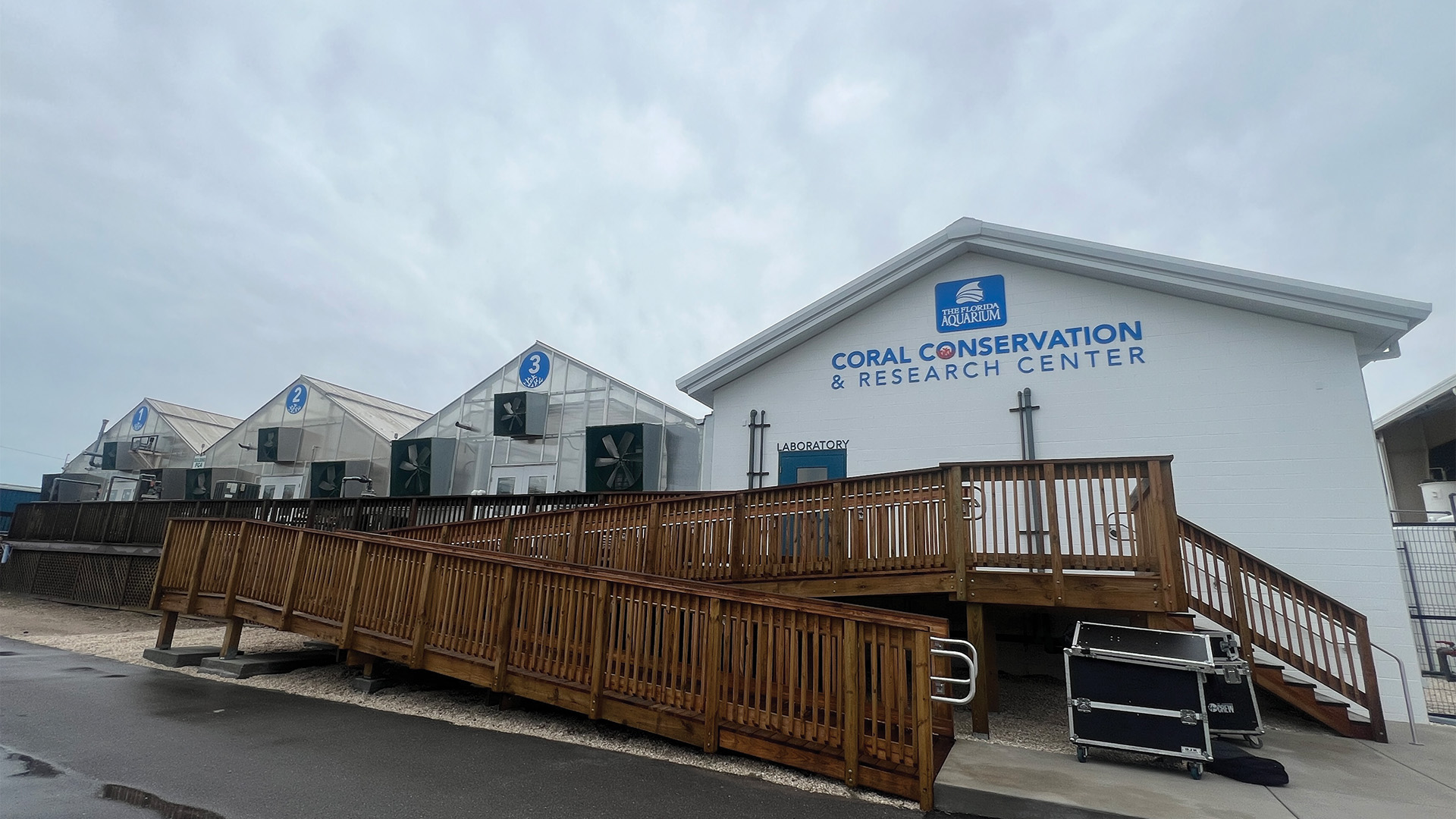 exterior of The Florida Aquarium's Coral Conservation Research Center including three greenhouses and a labratory