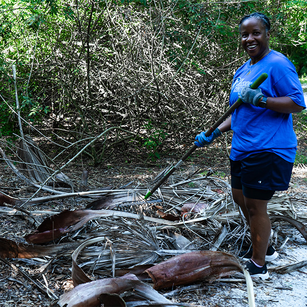 woman volunteering with The Florida Aquarium in habitat cleanup