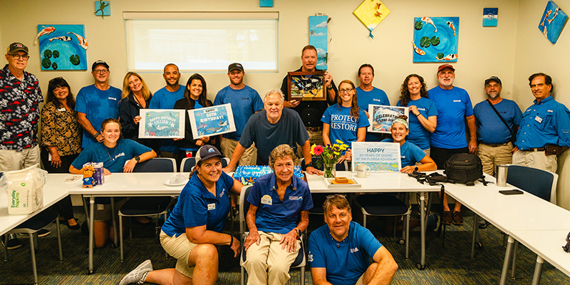 The Florida Aquarium staff celebrating Lillian Kenney 85th birthday and Last Dive.