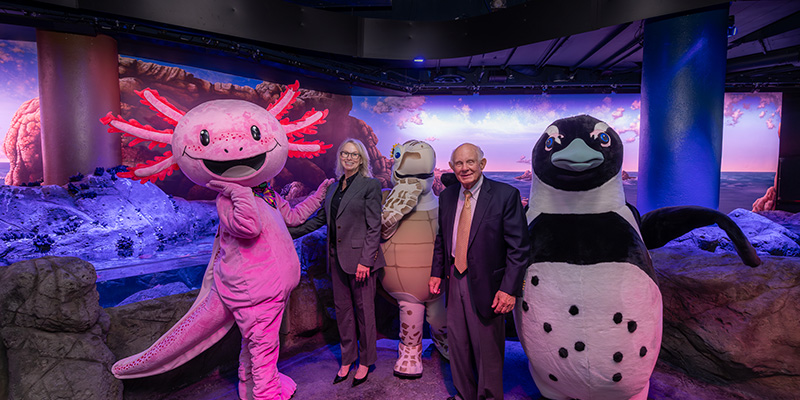 Bob Sharp and family with The Florida Aquarium characters at the opening of The Tide Pool