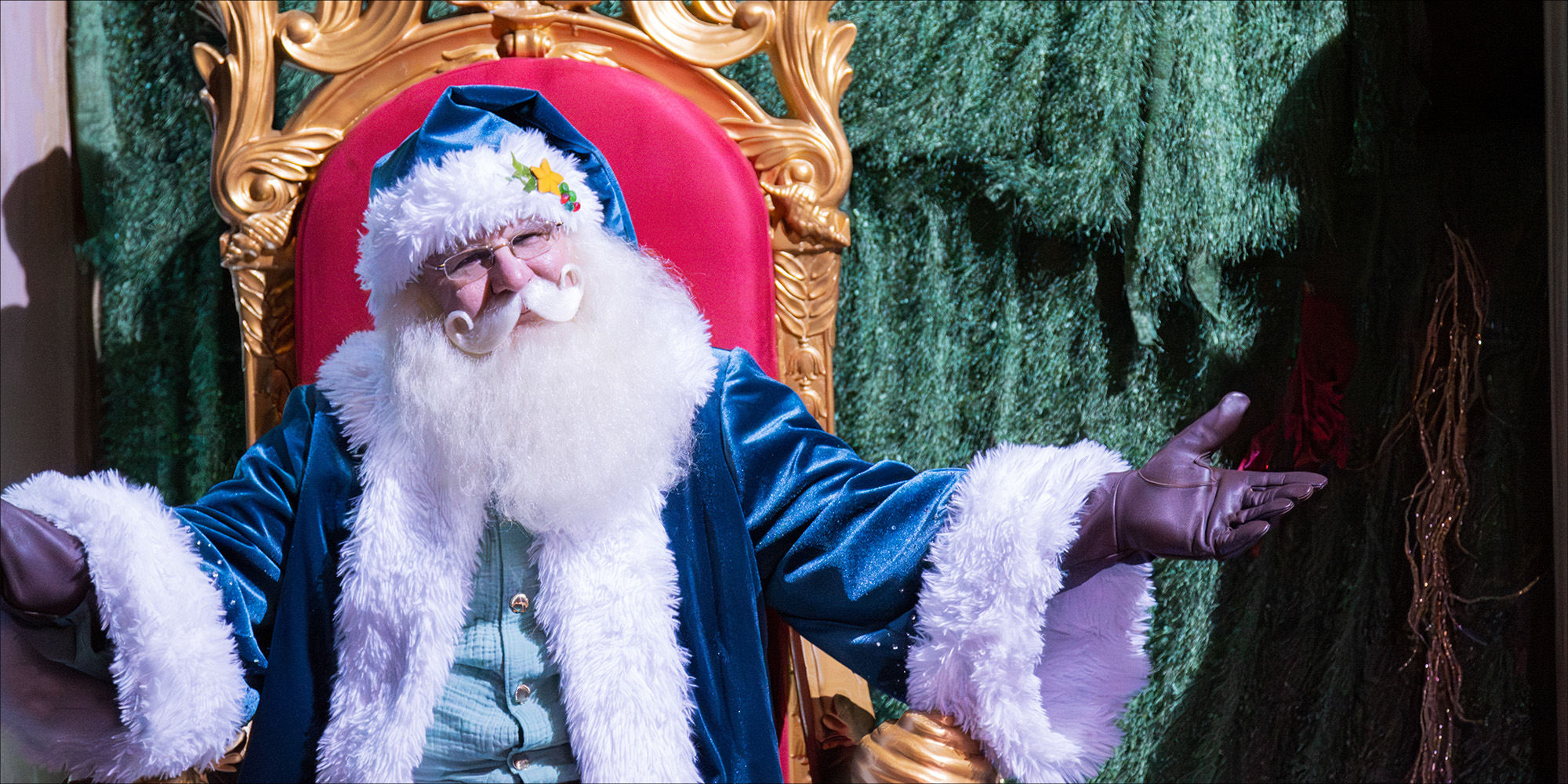 Santa waiting to greet guests at YuleTides at the Florida Aquarium
