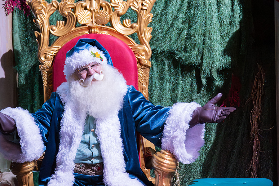 Santa waiting to greet guests at YuleTides at the Florida Aquarium