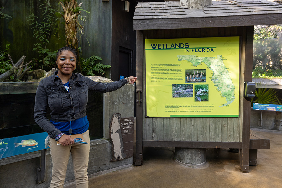guest engagement volunteer directing guests in the wetlands at the florida aquarium