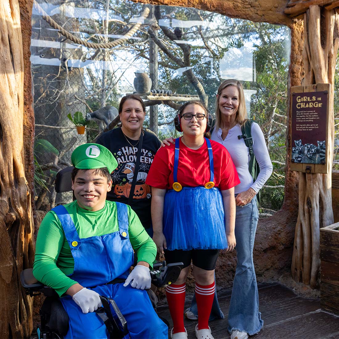 Guests dressed at the Super Mario brothers standing in front of the lemur habitat during Guppyween 2025 at The Florida Aquarium_1100x1100